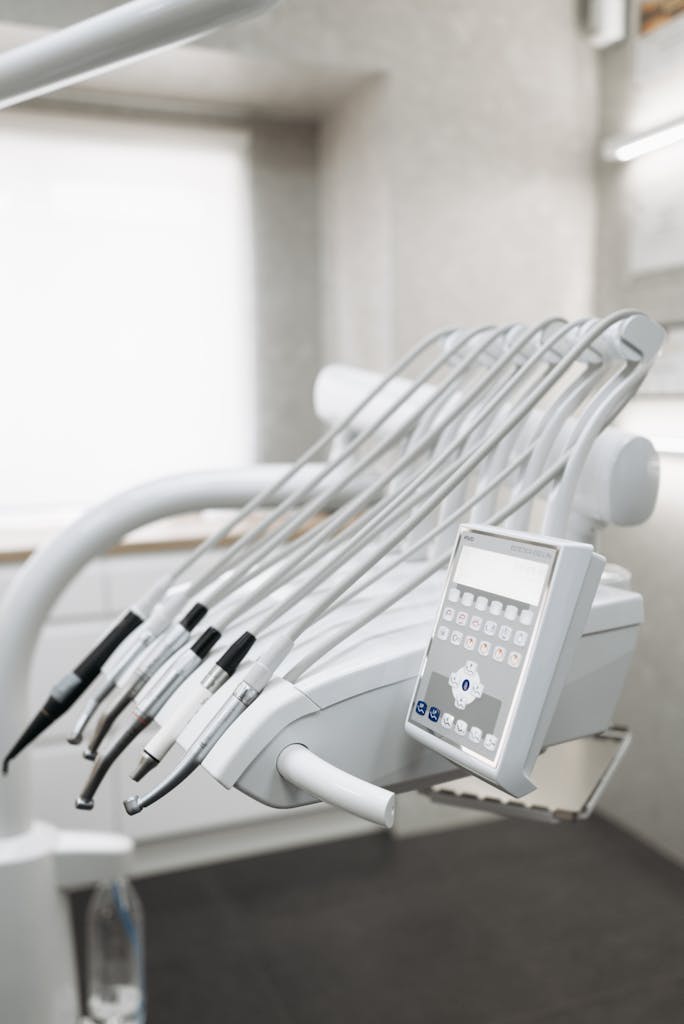 Close-up of modern dental tools in a well-lit dental office, emphasizing advanced healthcare technology.
